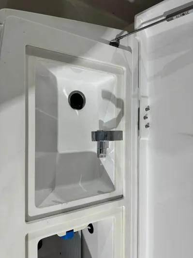 Escape Artist Yacht Photos Pics 2020 Axopar 37 Cross Cabin BRABUS sink with modern faucet design.