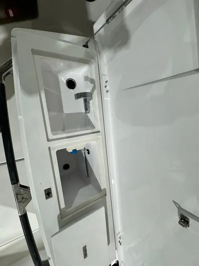 Escape Artist Yacht Photos Pics 2020 Axopar 37 Cross Cabin BRABUS interior storage compartments.