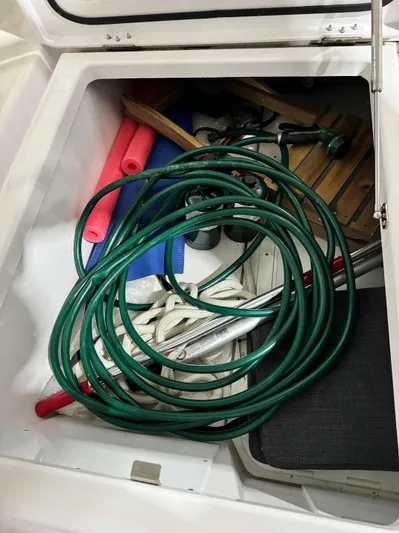 Escape Artist Yacht Photos Pics Storage compartment with hose and equipment on 2020 Axopar 37 Cross Cabin BRABUS.