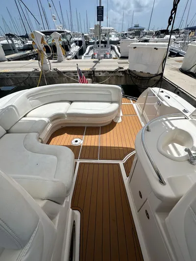  Yacht Photos Pics 2004 Sea Ray 340 Sundancer boat with spacious seating and teak deck at marina.