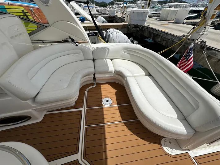  Yacht Photos Pics 2004 Sea Ray 340 Sundancer boat with white seating and wooden deck.