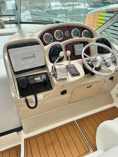  Yacht Photos Pics 2004 Sea Ray 340 Sundancer helm with Garmin navigation and wood accents.