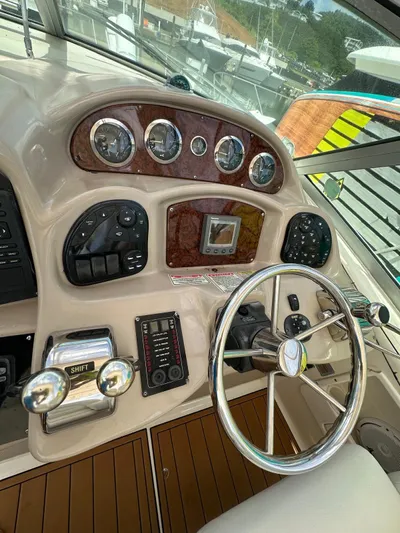  Yacht Photos Pics 2004 Sea Ray 340 Sundancer helm with gauges and steering wheel.