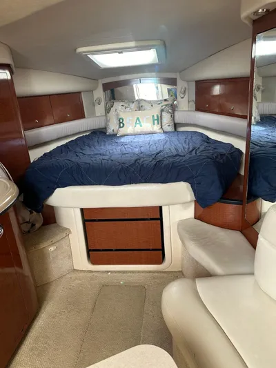  Yacht Photos Pics Luxurious 2004 Sea Ray 340 Sundancer cabin with cozy bed and elegant wood finishes.