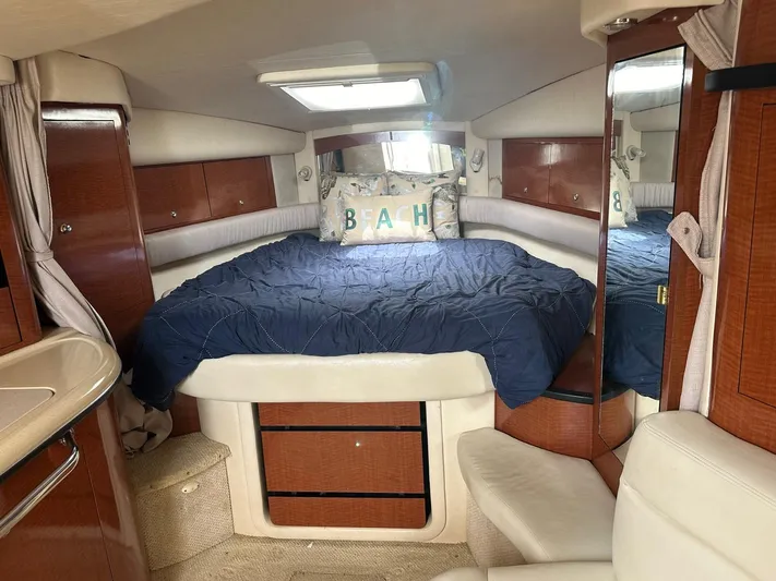  Yacht Photos Pics Interior of 2004 Sea Ray 340 Sundancer with cozy bed and nautical decor.