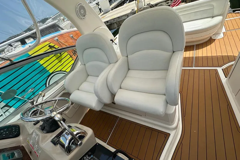  Yacht Photos Pics 2004 Sea Ray 340 Sundancer cockpit with plush seating and sleek controls.