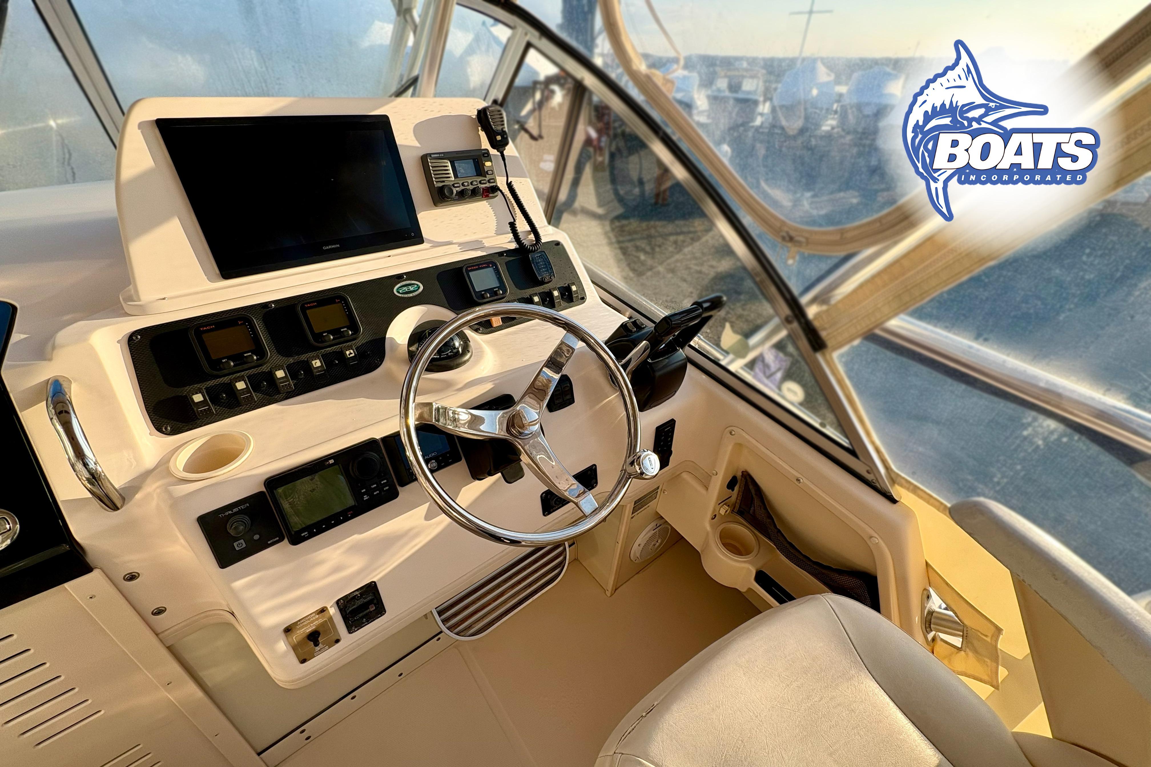 2008 Grady-White Sailfish 282 boat helm with steering wheel and navigation equipment.