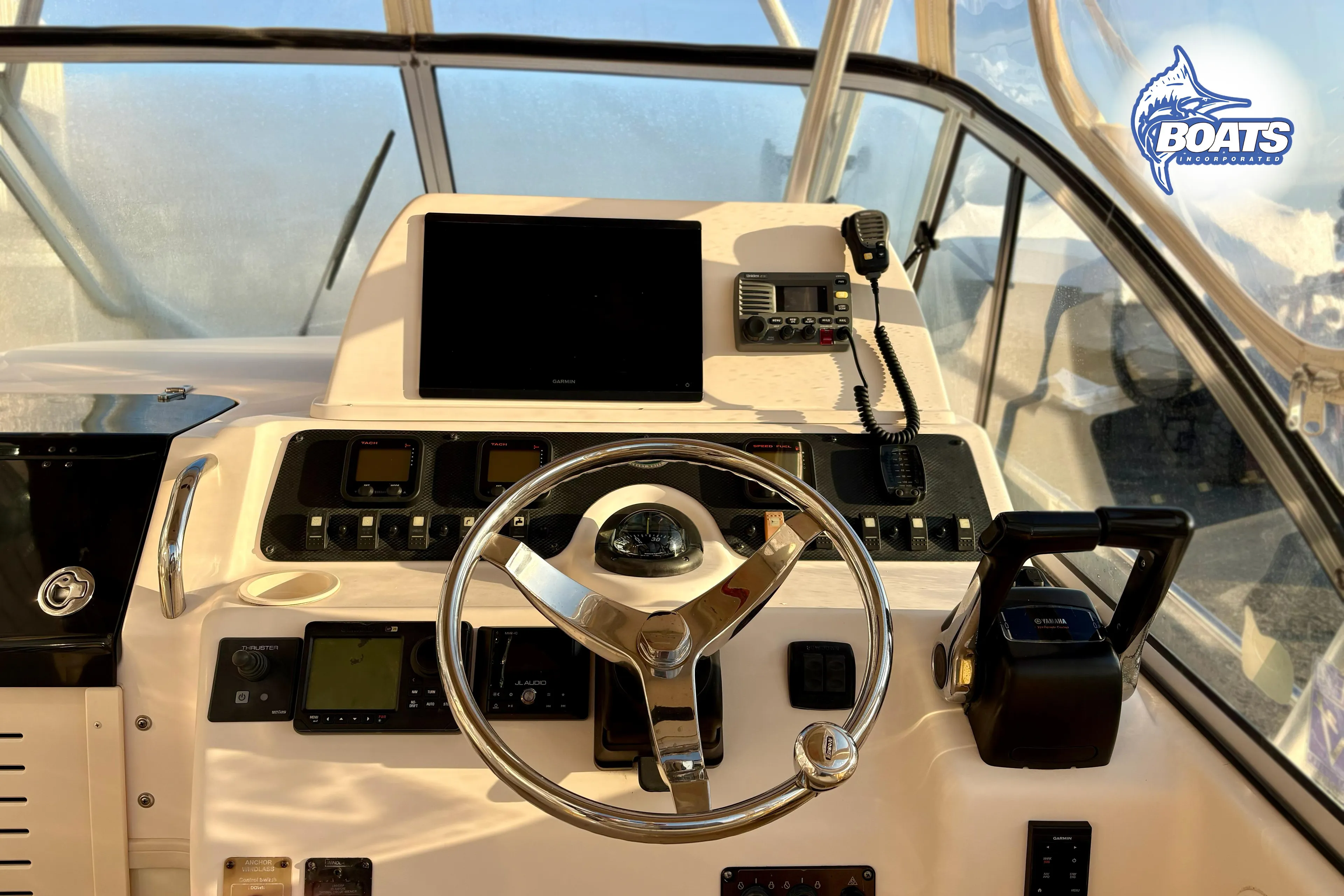 2008 Grady-White Sailfish 282 helm with steering wheel, controls, and navigation equipment.