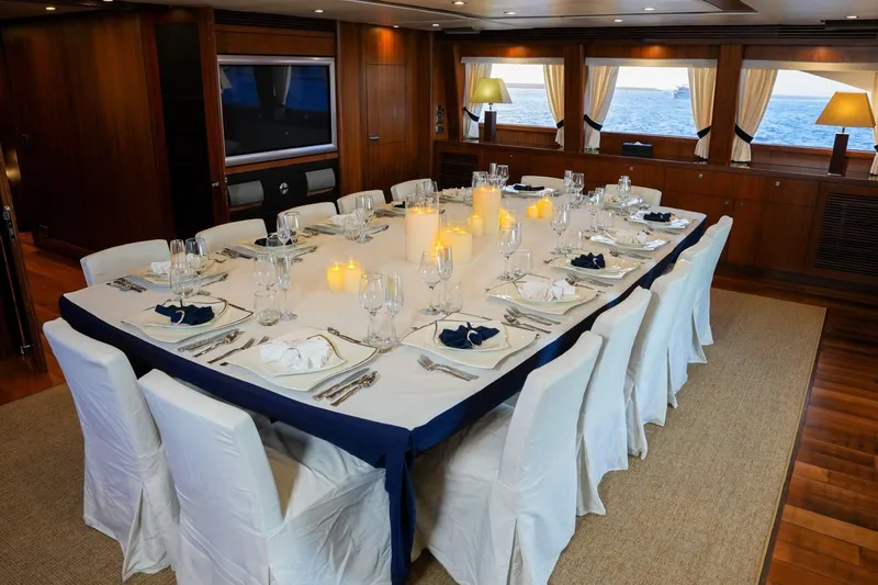  Yacht Photos Pics Luxurious dining area on 2010 Sunseeker 40M yacht, elegantly set table with ocean view.