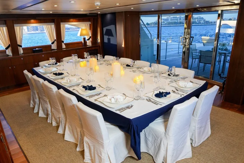  Yacht Photos Pics Luxurious dining area on a 2010 Sunseeker 40M yacht, elegantly set with candles and tableware.