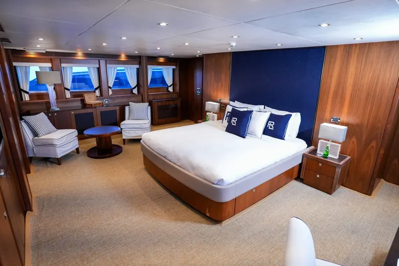  Yacht Photos Pics Luxurious Sunseeker 40M 2010 yacht bedroom with elegant wood paneling and plush furnishings.