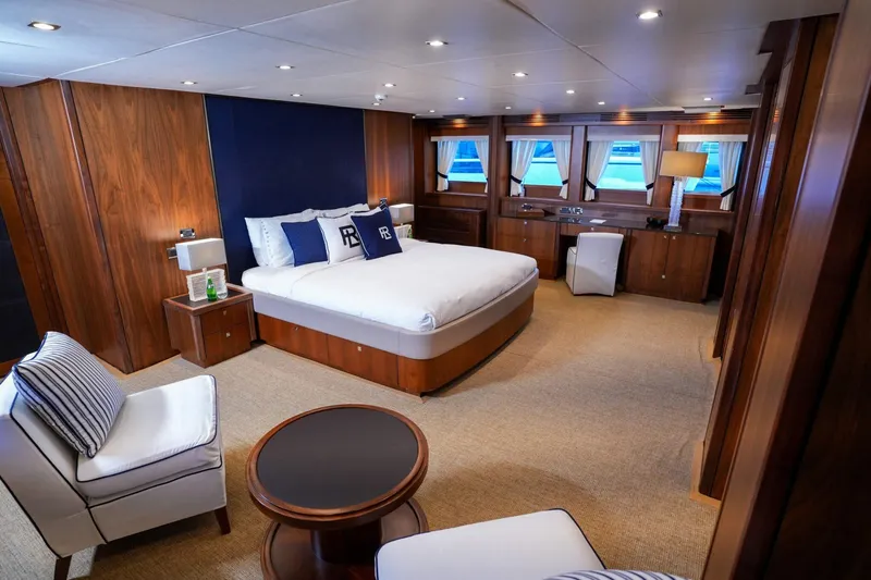  Yacht Photos Pics Luxurious Sunseeker 40M 2010 yacht bedroom with elegant wood paneling and modern furnishings.