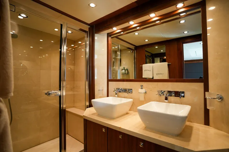  Yacht Photos Pics Luxurious bathroom on 2010 Sunseeker 40M yacht with dual sinks and glass shower.