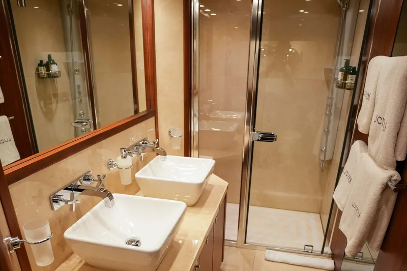  Yacht Photos Pics Luxurious bathroom in 2010 Sunseeker 40M yacht with dual sinks and glass shower.