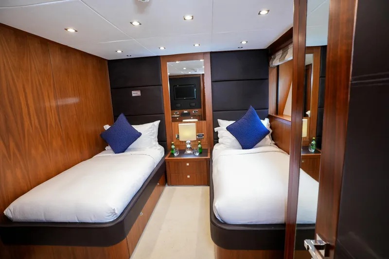  Yacht Photos Pics Luxurious twin cabin on 2010 Sunseeker 40M yacht with elegant wood paneling.