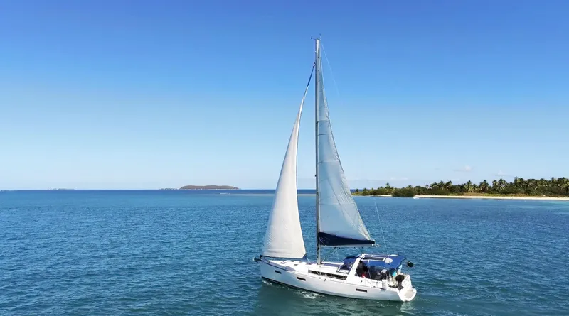 Angela Yacht Photos Pics Sailing yacht Beneteau Oceanis 41, 2013 model, cruising on clear blue waters.