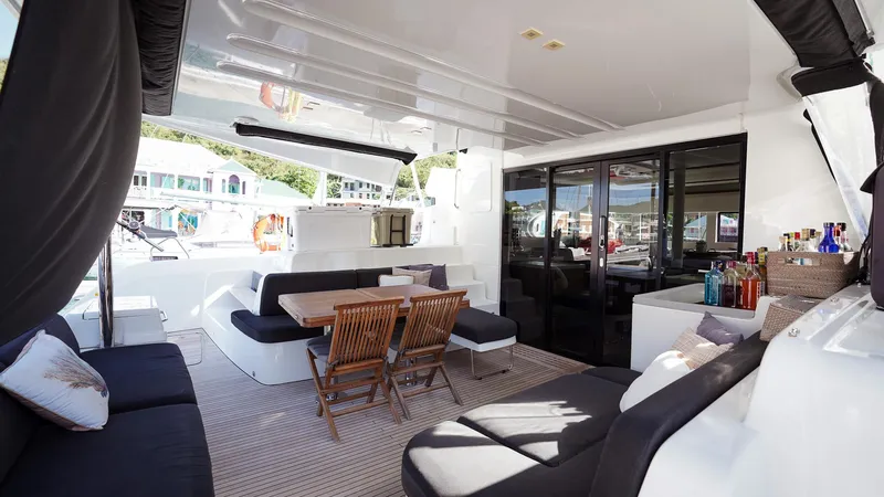 Karma Yacht Photos Pics Luxurious 2020 Lagoon 50 yacht interior with seating, dining area, and bar setup.