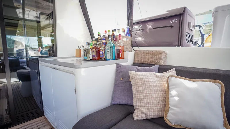 Karma Yacht Photos Pics Luxurious Lagoon 50 yacht interior with bar setup and cozy seating, 2020 model.