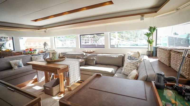 Karma Yacht Photos Pics Luxurious interior of 2020 Lagoon 50 catamaran with spacious seating and elegant decor.