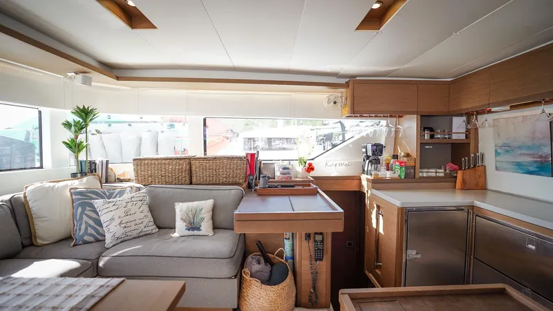 Karma Yacht Photos Pics Interior of 2020 Lagoon 50 catamaran with modern kitchen and cozy seating area.