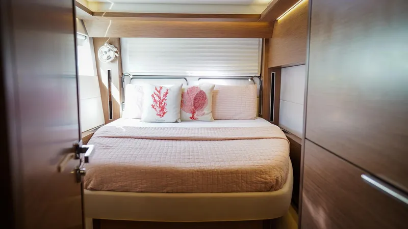 Karma Yacht Photos Pics Luxurious bedroom interior of 2020 Lagoon 50 yacht with cozy bedding and elegant decor.