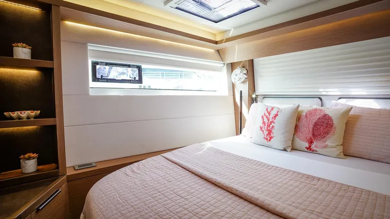 Karma Yacht Photos Pics Luxurious cabin interior of 2020 Lagoon 50 yacht with cozy bedding and modern design.