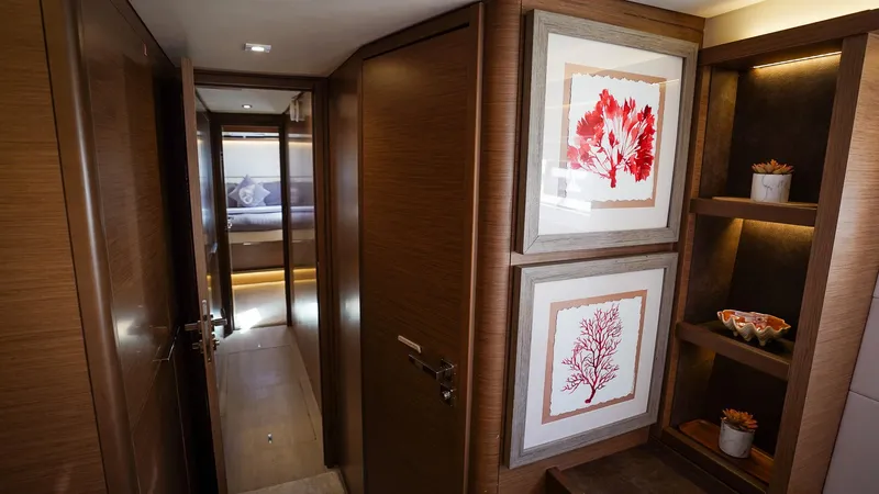 Karma Yacht Photos Pics Luxurious interior hallway of 2020 Lagoon 50 yacht with framed coral artwork.