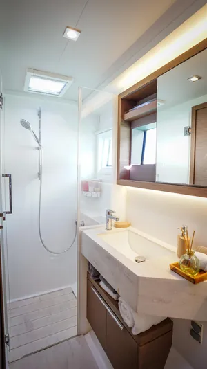 Karma Yacht Photos Pics Modern bathroom in 2020 Lagoon 50 yacht with shower and sleek vanity.