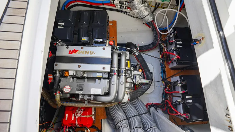 Karma Yacht Photos Pics Engine compartment of a 2020 Lagoon 50 catamaran, showcasing mechanical components and wiring.