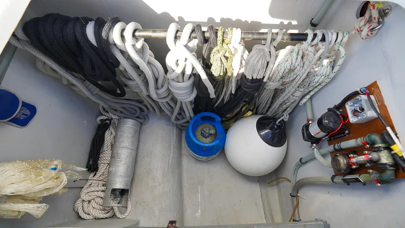 Karma Yacht Photos Pics Storage compartment on a 2020 Lagoon 50 yacht with ropes, buoy, and equipment.