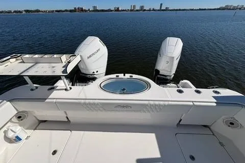  Yacht Photos Pics 2021 Invincible 35 Catamaran with dual Mercury engines on calm water.