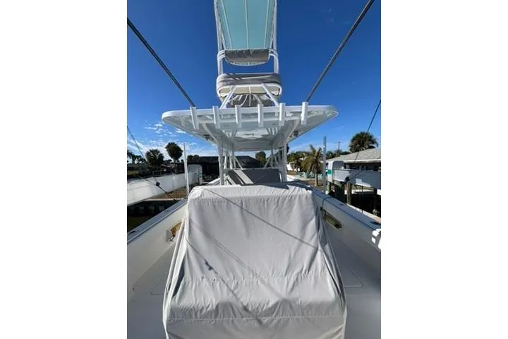  Yacht Photos Pics 2021 Invincible 35 Catamaran with covered seating and clear blue sky background.