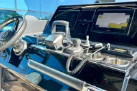 Control panel of 2025 Solaris Power 40F Open yacht with navigation display and steering wheel.