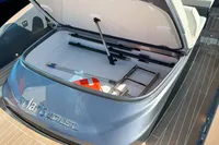 Open storage compartment on Solaris Power 40F Open yacht, showcasing interior features and equipment.