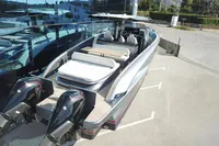 2025 Solaris Power 40F Open yacht with dual outboard engines, docked outdoors.