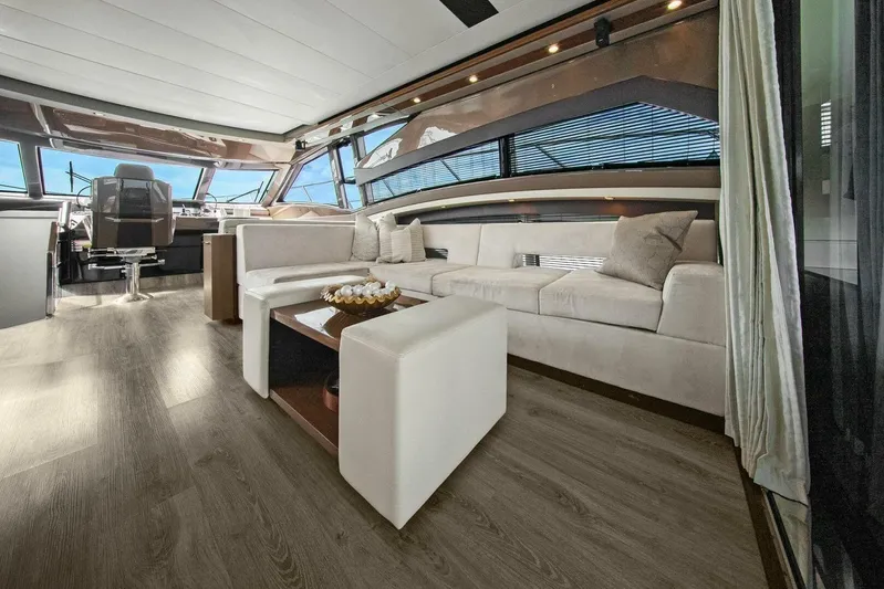 7th Heaven Yacht Photos Pics Luxurious interior of 2014 Marquis 630 Sport Yacht with modern seating and elegant decor.
