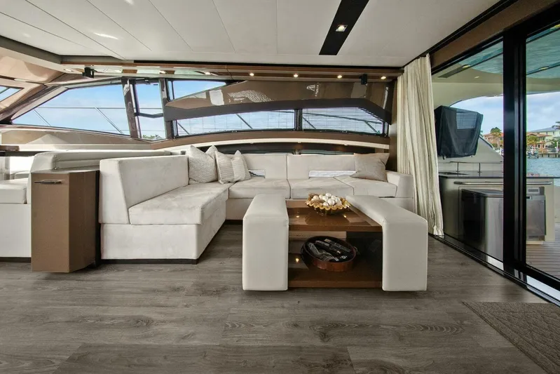 7th Heaven Yacht Photos Pics Luxurious interior of 2014 Marquis 630 Sport Yacht with elegant seating and modern decor.