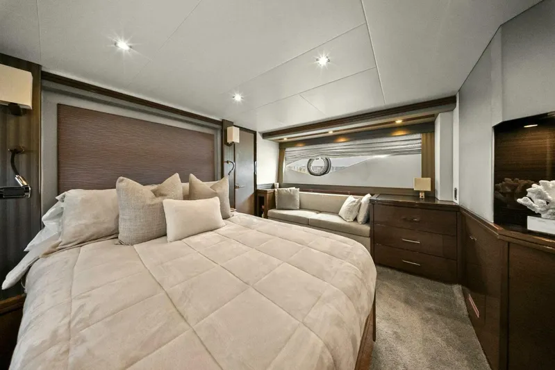 7th Heaven Yacht Photos Pics Luxurious bedroom interior of 2014 Marquis 630 Sport Yacht with elegant furnishings.