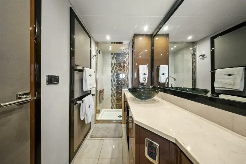 7th Heaven Yacht Photos Pics Luxurious bathroom in 2014 Marquis 630 Sport Yacht with modern fixtures and elegant design.
