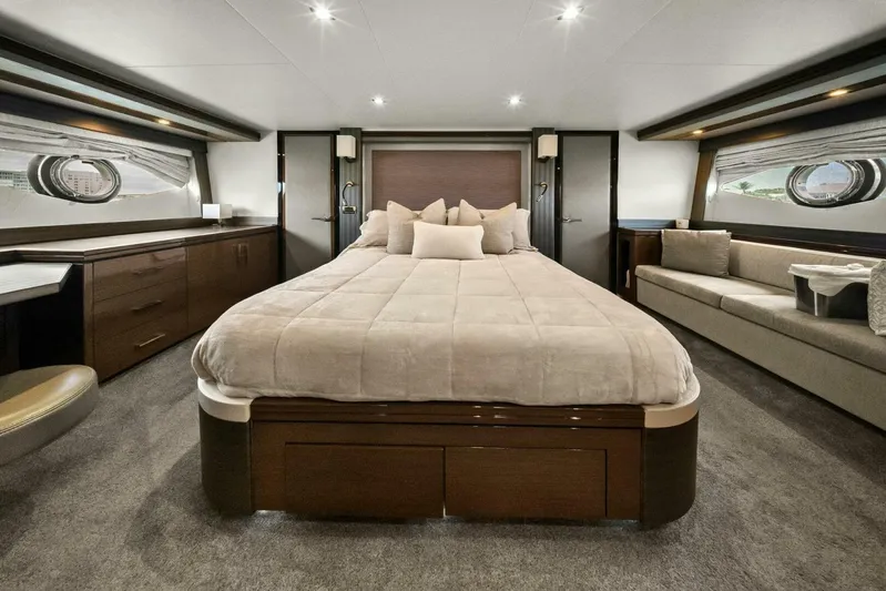 7th Heaven Yacht Photos Pics Luxurious interior of 2014 Marquis 630 Sport Yacht master bedroom with elegant furnishings.