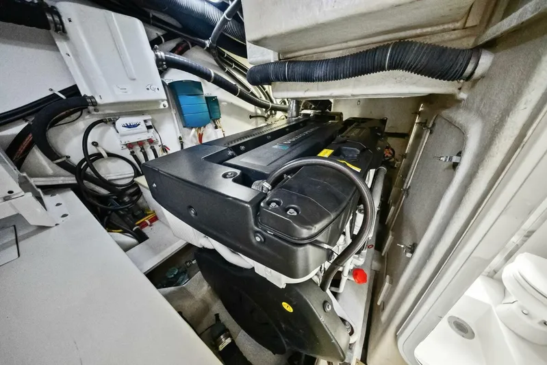 7th Heaven Yacht Photos Pics Engine room of a 2014 Marquis 630 Sport Yacht, showcasing mechanical components.