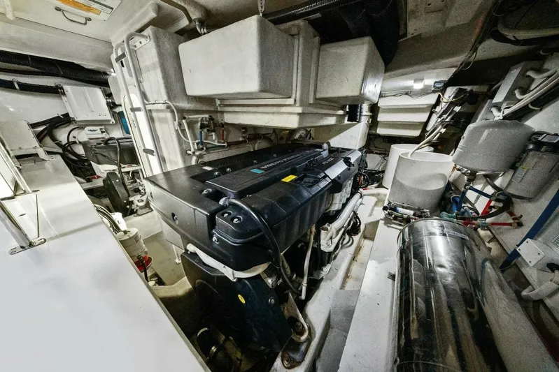 7th Heaven Yacht Photos Pics Engine room of a 2014 Marquis 630 Sport Yacht, showcasing mechanical components and systems.
