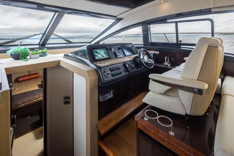 You Betcha Yacht Photos Pics Interior of 2016 Sea Ray 400 Sundancer yacht with modern helm and seating.