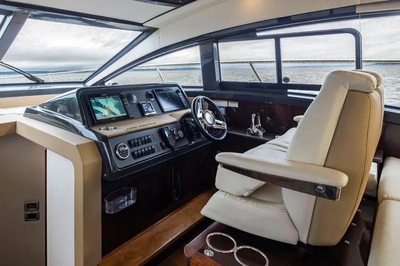 You Betcha Yacht Photos Pics Interior of 2016 Sea Ray 400 Sundancer yacht, featuring modern helm and luxurious seating.