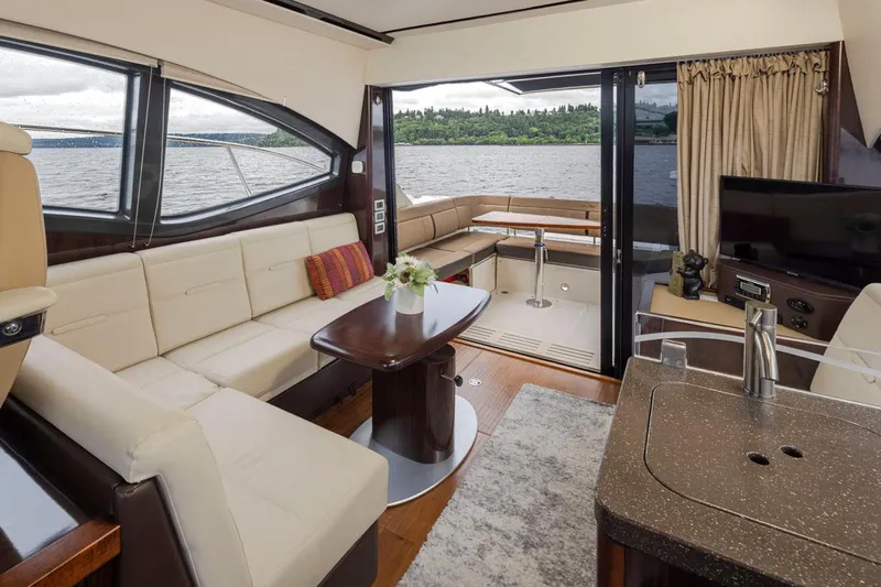 You Betcha Yacht Photos Pics Luxurious interior of 2016 Sea Ray 400 Sundancer yacht with elegant seating and scenic water view.