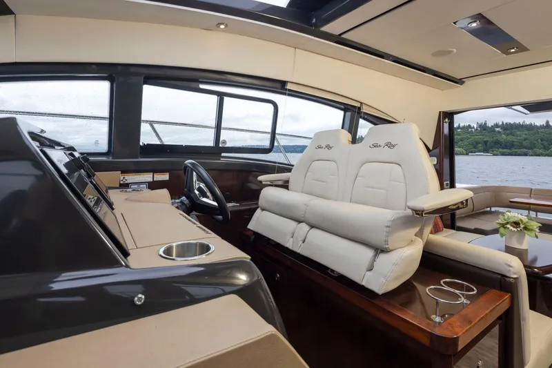 You Betcha Yacht Photos Pics Interior of 2016 Sea Ray 400 Sundancer yacht with luxurious seating and helm.