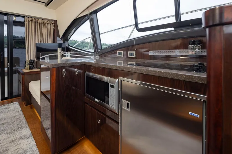 You Betcha Yacht Photos Pics Luxurious interior of 2016 Sea Ray 400 Sundancer yacht with modern kitchen amenities.