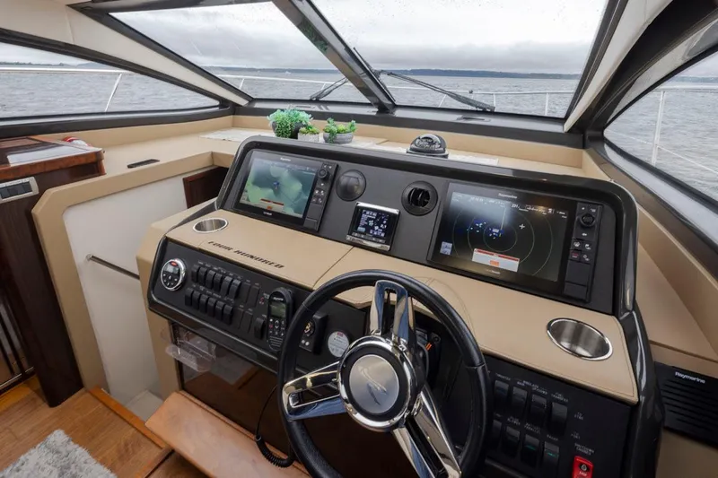 You Betcha Yacht Photos Pics Helm of 2016 Sea Ray 400 Sundancer yacht with modern navigation equipment.