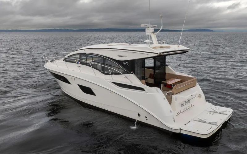 You Betcha Yacht Photos Pics 2016 Sea Ray 400 Sundancer yacht on open water under cloudy skies.