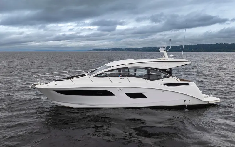 You Betcha Yacht Photos Pics 2016 Sea Ray 400 Sundancer yacht on open water under cloudy skies.